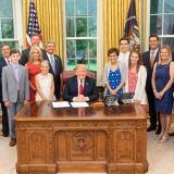 Photo: Various members of Congress with President Trump