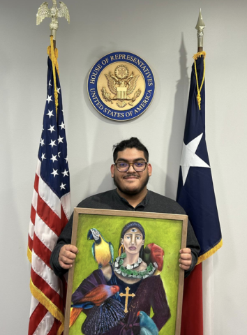 Christian showing his artwork at Rep. McCaul's Brazos County office